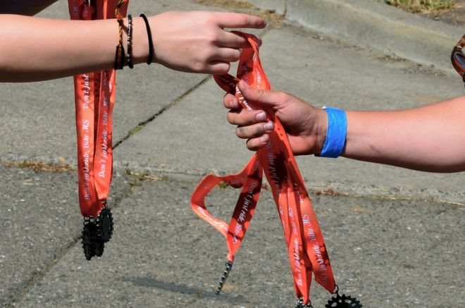 Mel receiving medals for team
