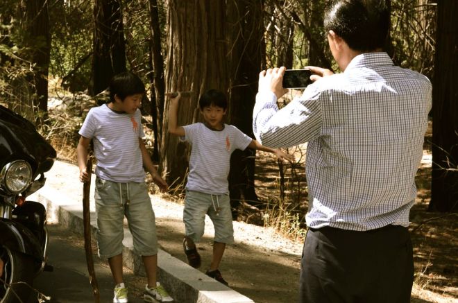 Japanese boys posing by the Harley